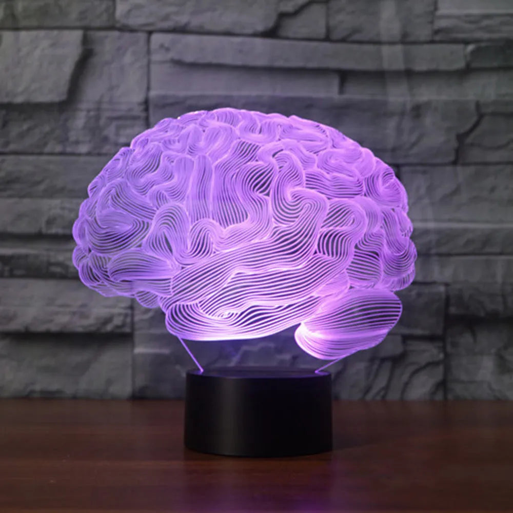 3D acrylic illusion desk lamp with colourful LED lights on a wooden desk, remote control nearby.