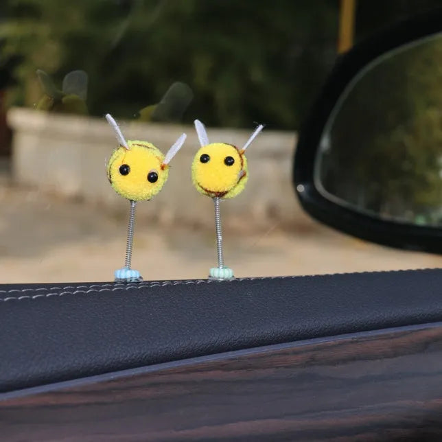 Soft fur ball Swing Spring Bee car decoration ornament measuring 3 by 3 centimetres.
