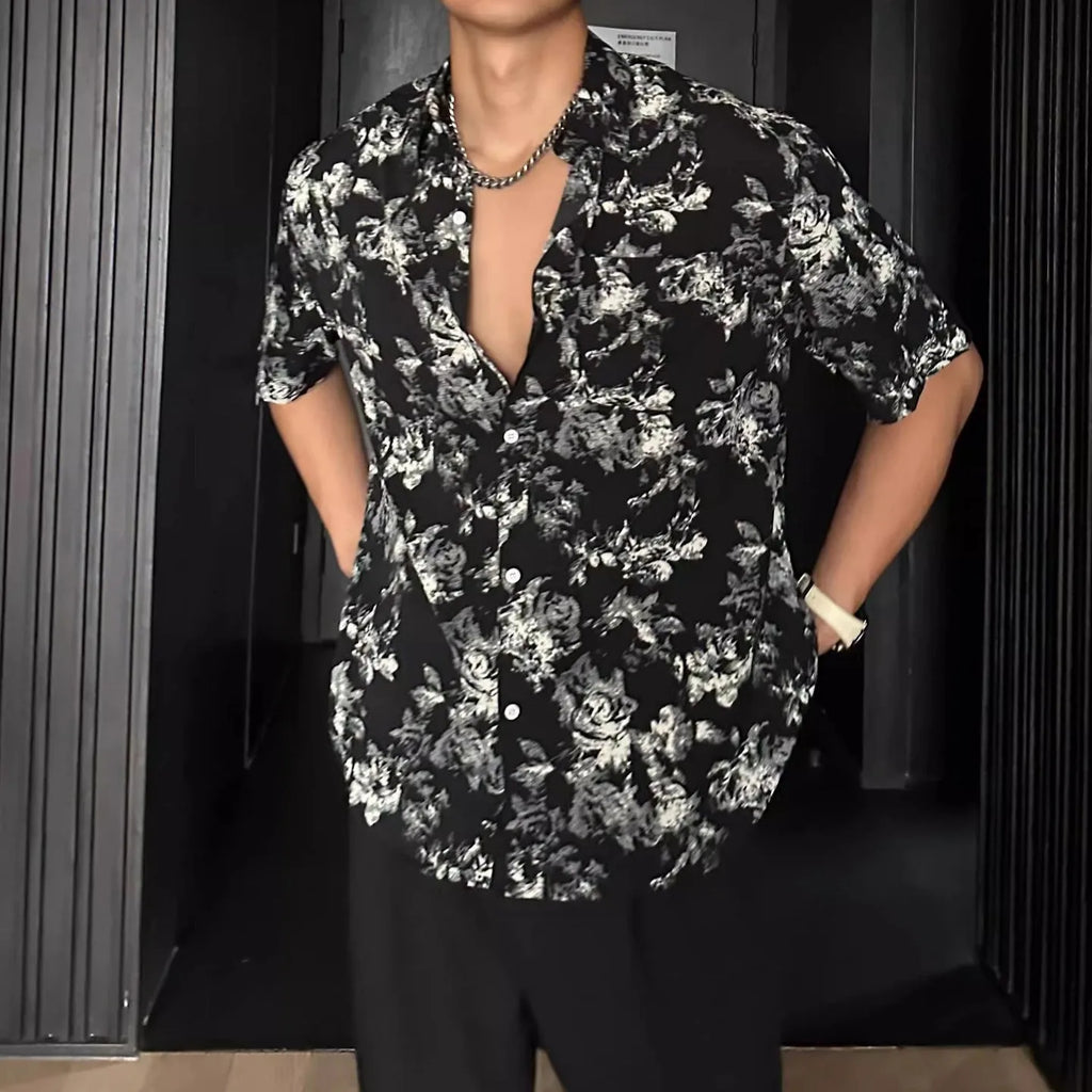 Loose-fitting white women's short sleeve shirt with a floral print pattern.