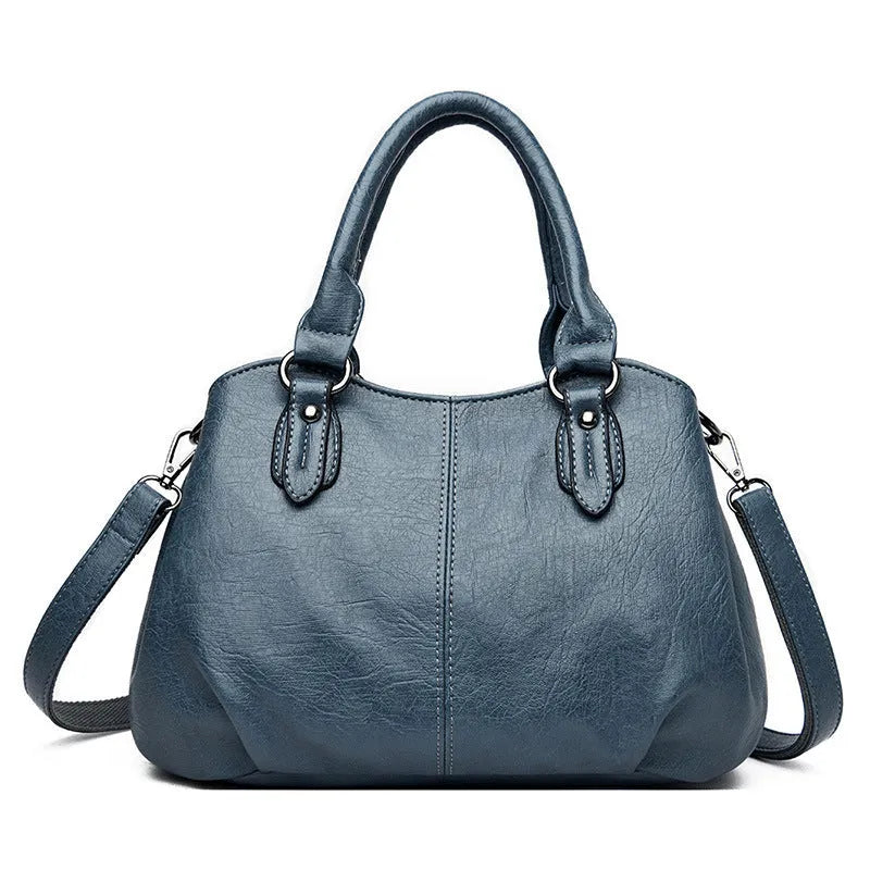 Large capacity crossbody backpack in dumpling shape with PU material and visible sewing line detailing