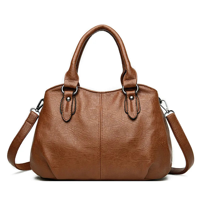 Large capacity crossbody backpack in dumpling shape with PU material and visible sewing line detailing