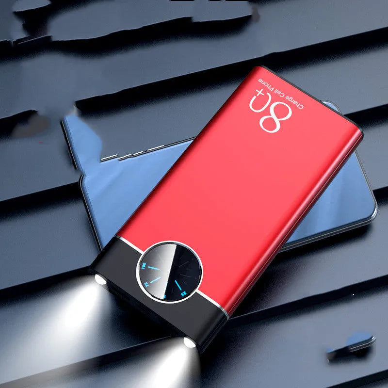 Black alloy fast charging power bank showing front with USB ports and LED flashlight.