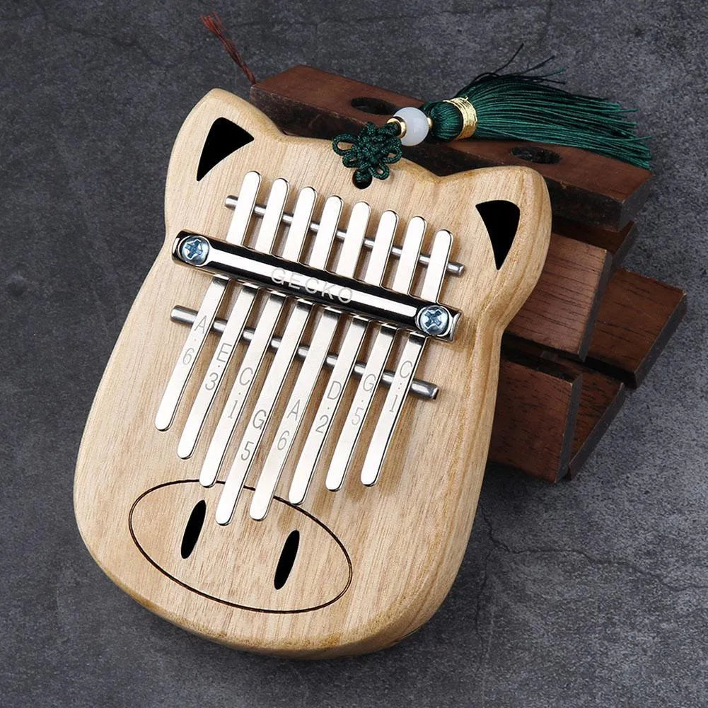 Camphorwood Mini K8 keyboard percussion instrument with five sounds in Piggy colour, 11.5 x 9 x 3 cm, with long and short lanyards