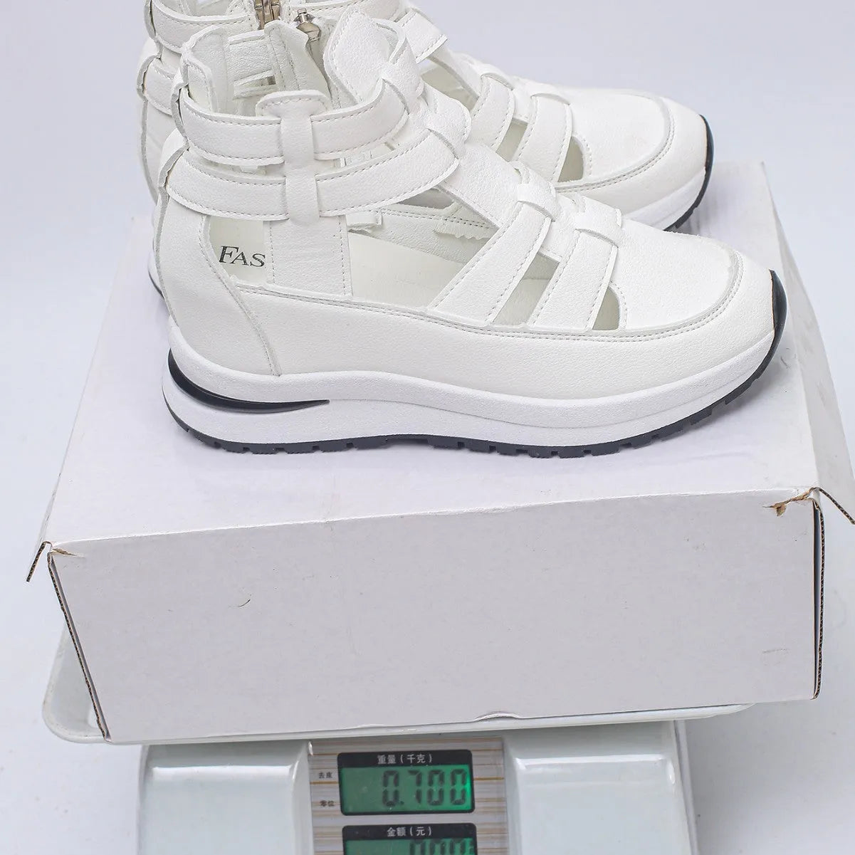 Black women's platform sandals with closed toe, hollow-out design and Velcro strap.