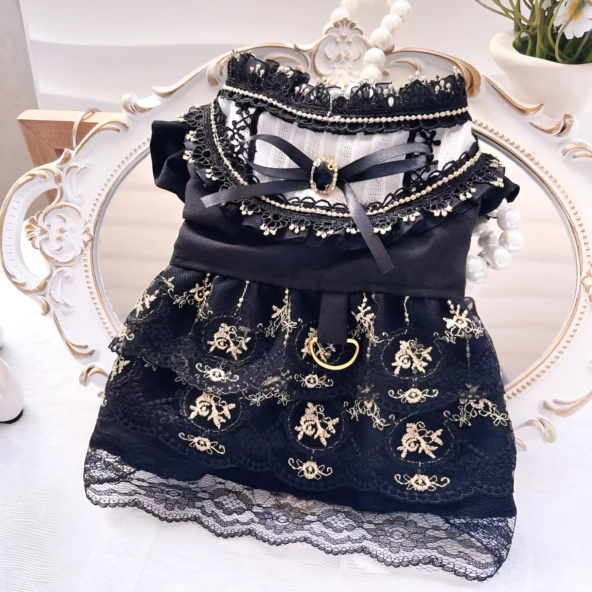 Golden gothic-style layered skirt for a small dog or cat on a mannequin, showing adjustable velvet collar.