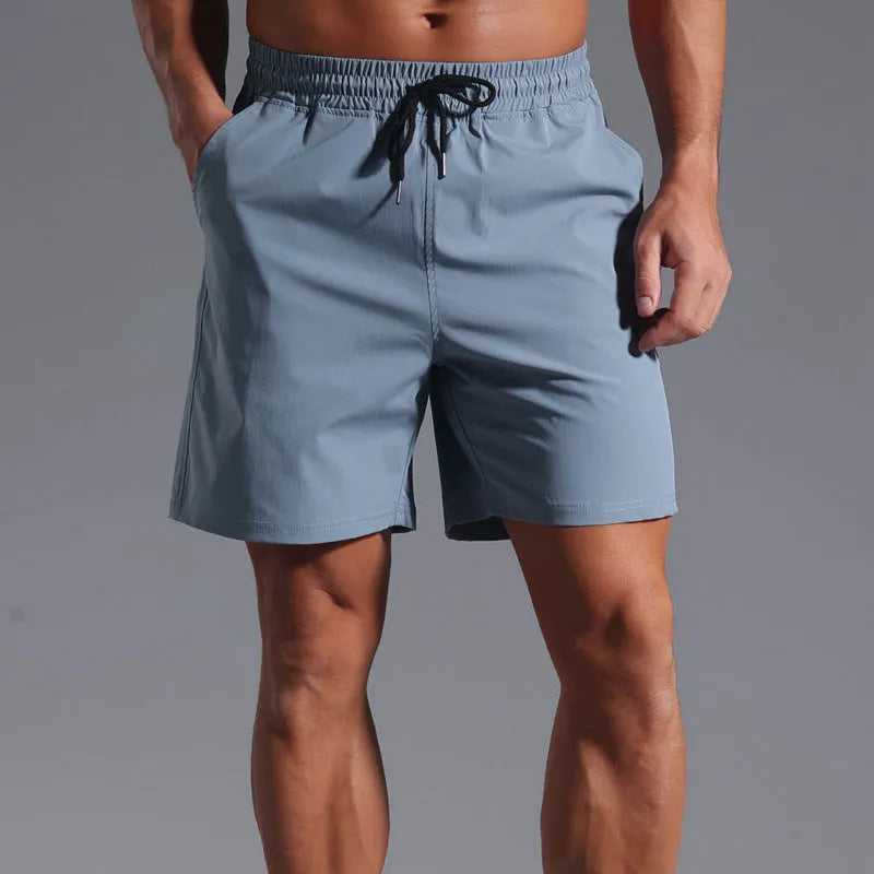 Men's loose straight-leg shorts in quick-dry polyester fabric showing four colour options