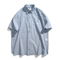 Blue striped overalls shirt for men and women in loose fit cardigan style with short sleeves