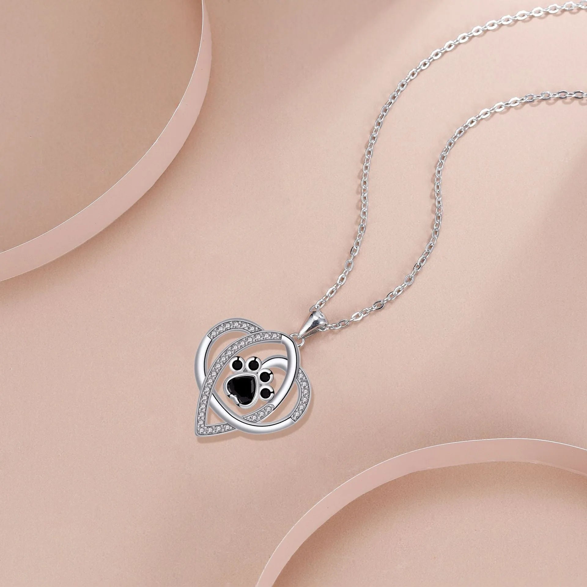 Women's copper necklace with dog paw pendant on cross chain