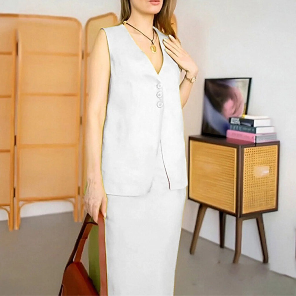 A woman modelling a blue sleeveless vest and matching long skirt from a casual two-piece suit.