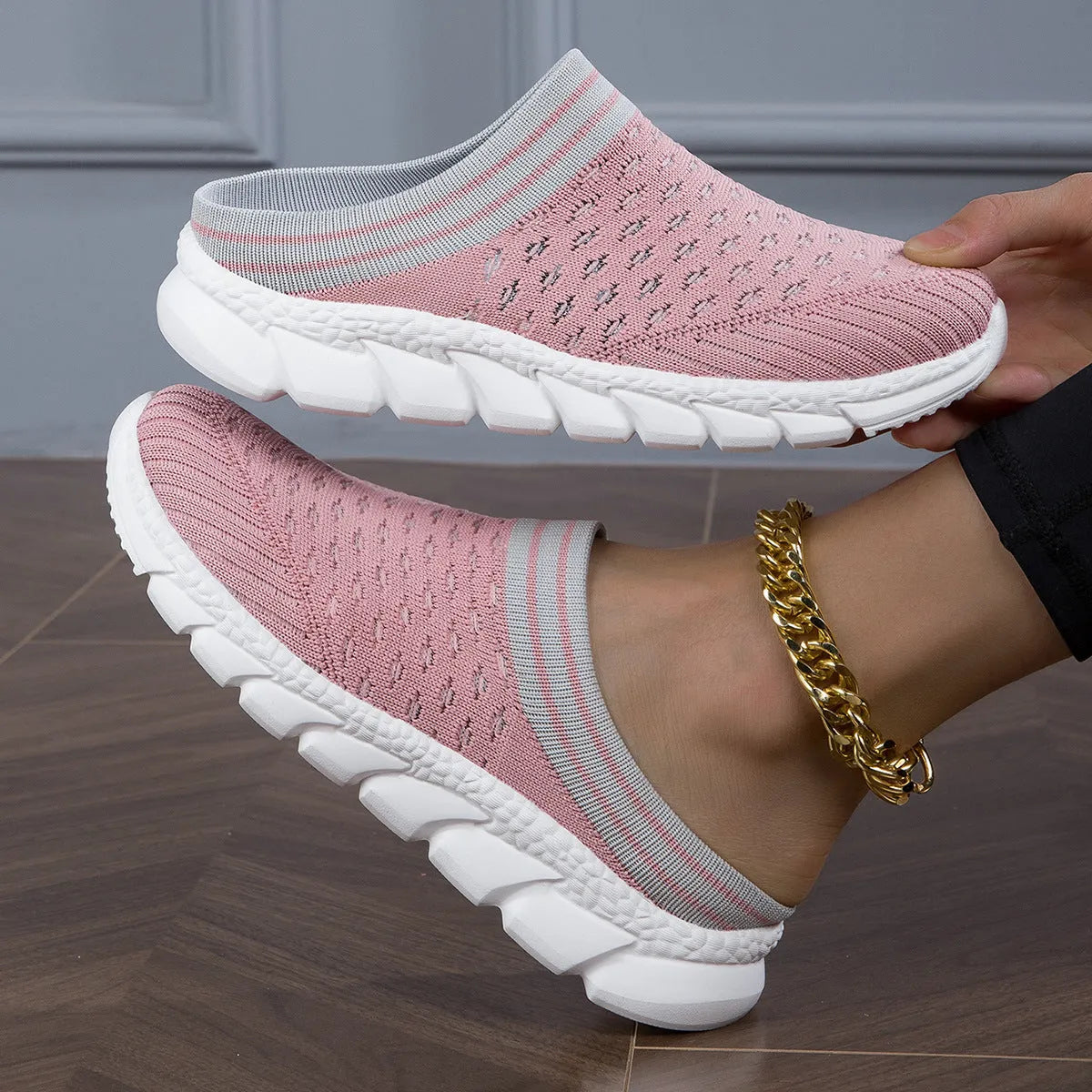 Women's black Flyknit socks slippers with a hollowed-out pattern and viscose sole.