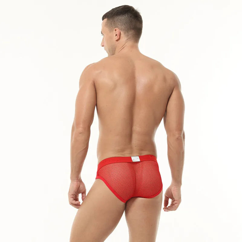 Men's solid colour mesh briefs with low elastic waistband in black, white, pink, red, and blue.