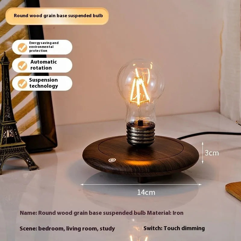 Iron art suspension bulb night lamp on a black wooden square base for desktop decoration.
