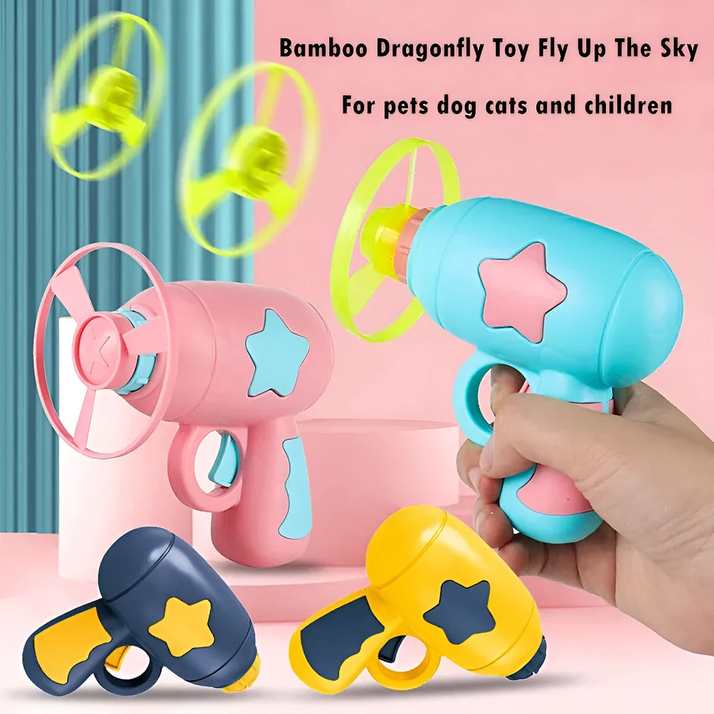 Blue plastic flying saucer launcher toy with LED-lit discs on a yellow target board.