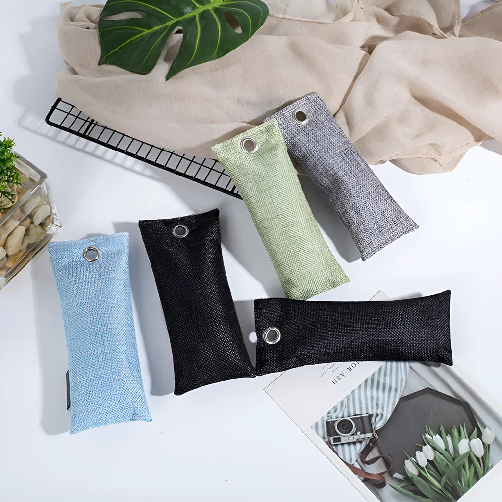 Black linen bag filled with bamboo charcoal for shoe and household odour removal.