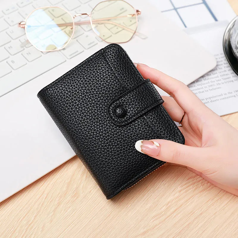 Ladies' short wallet with lychee pattern in PU material showing two-fold design