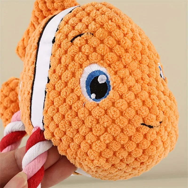 Grey turtle-shaped stuffed dog toy with a visible rope knot centre for chewing.