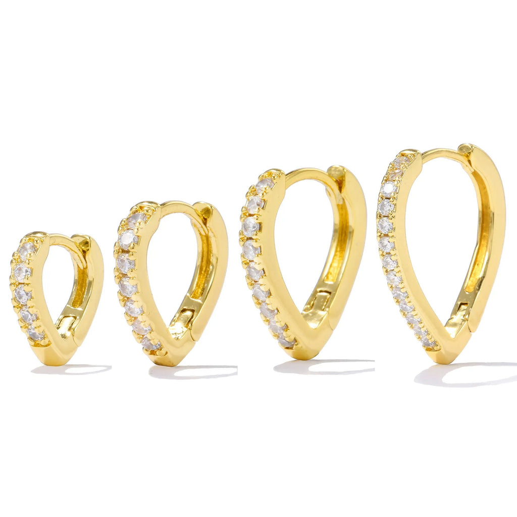 A geometric heart-shaped gold ear clip for women on a white background.