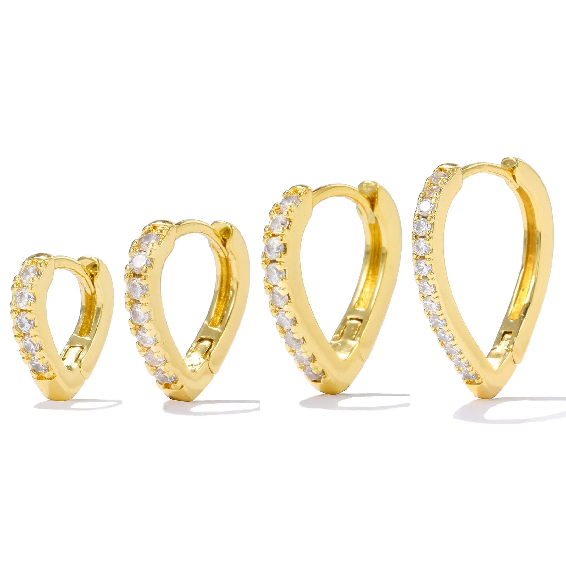 A geometric heart-shaped gold ear clip for women on a white background.