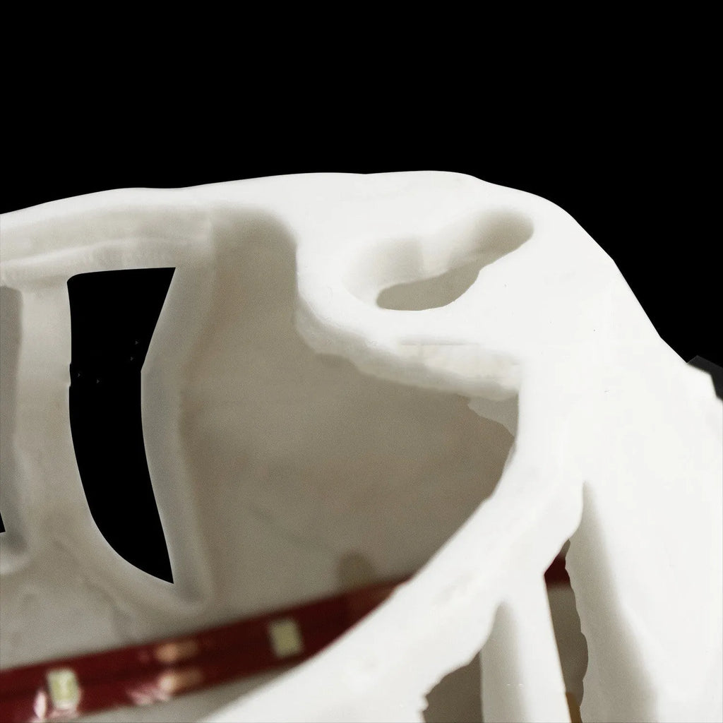 3D print resin wall lamp shaped like an owl projecting light and shadow onto a wall