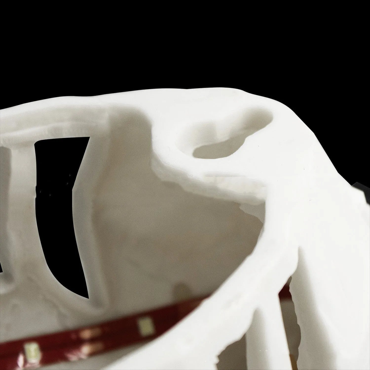 3D print resin wall lamp shaped like an owl projecting light and shadow onto a wall