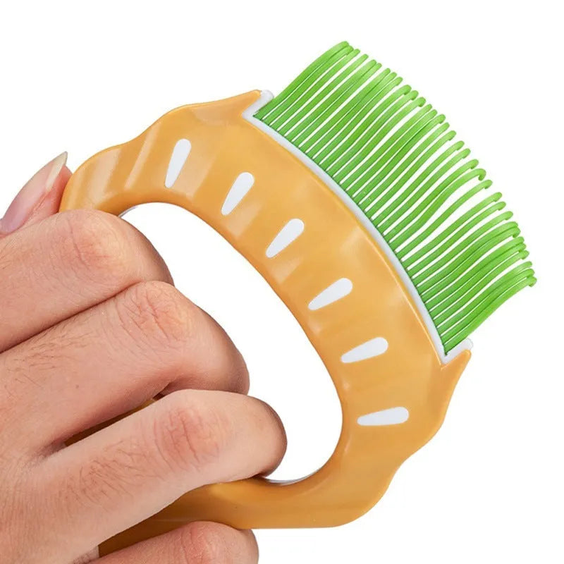 Shell-shaped plastic pet grooming comb with bent wire bristles in green, orange, or purple colours.