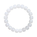 White Hetian jade barrel bead bracelet showing smooth, polished beads on a wrist.