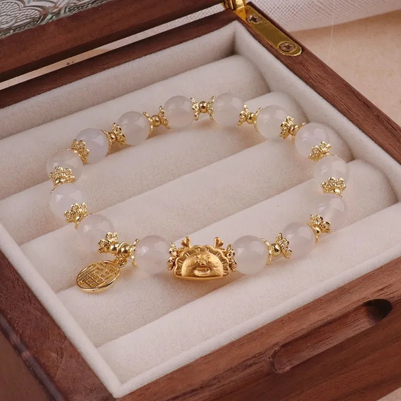 Women's floral bracelet with ice crack glaze beads, glass beads, and an electroplated zodiac charm.