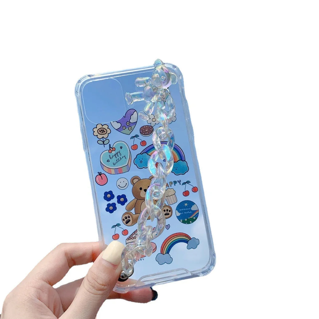 Transparent TPU iPhone case with bear chain and pendant attachment showing phone protection