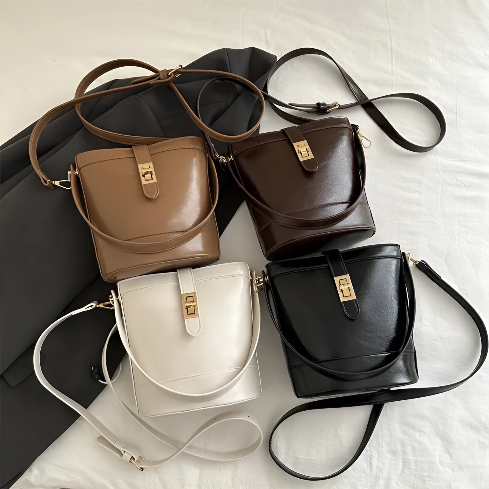 Women's one shoulder crossbody bag bucket shape in PU leather, available in black, brown, khaki, white. Width 19cm height 18.5cm.