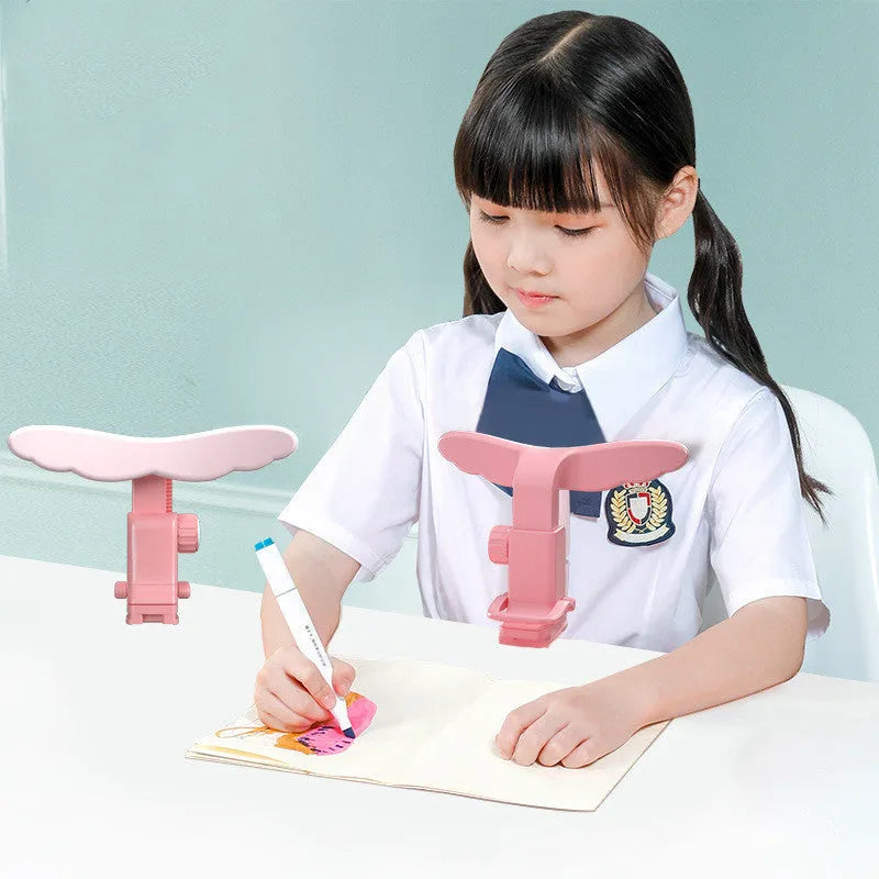 Student anti-myopia seated orthosis in blue on a desk, made from silicone and ABS material