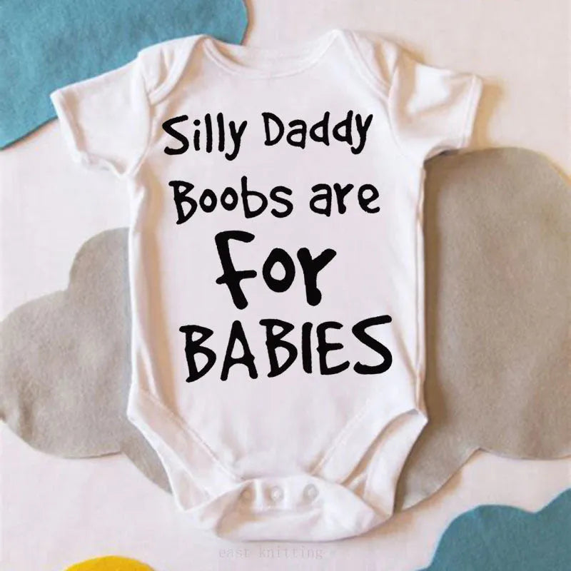 White triangle climbing vest top with printed text 'Silly Daddy Boobs Are For Babies' on the front