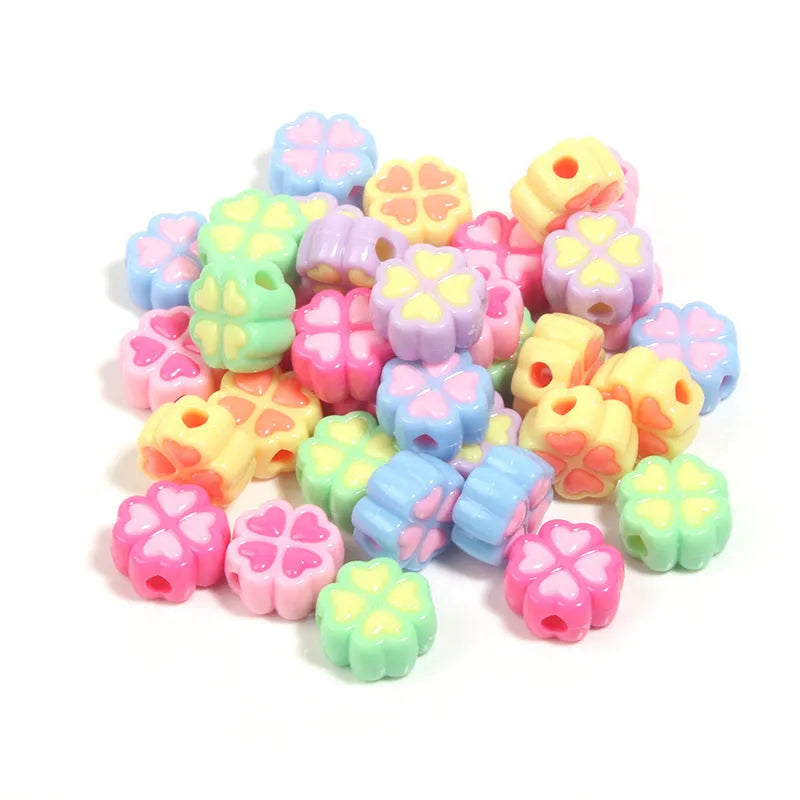 Assortment of 15mm frosted acrylic four-leaf clover beads in rose red, pink, yellow, green, blue, and purple.