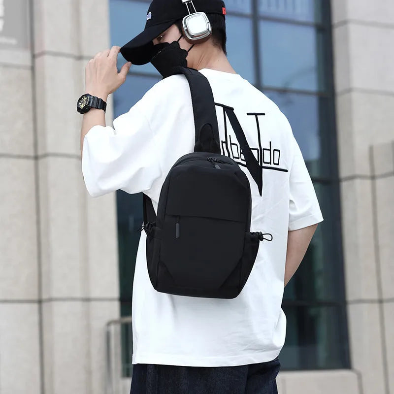 Men's grey waterproof chest bag showing front compartment and shoulder strap