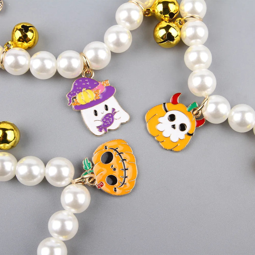 Decorative Halloween cat collar with simulated pearls and pumpkin charm in purple ghost design