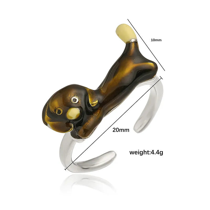 Copper open mouth ring with colourful drip oil finish and sausage dog animal motif