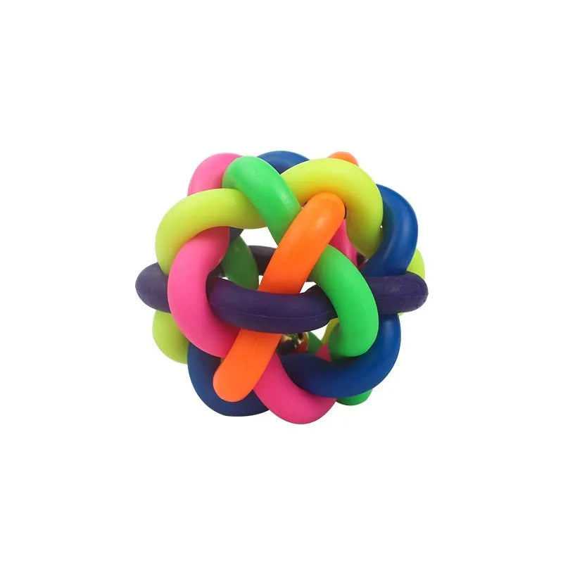 Colourful woven plastic pet toy ball with bell in rainbow colour on white background