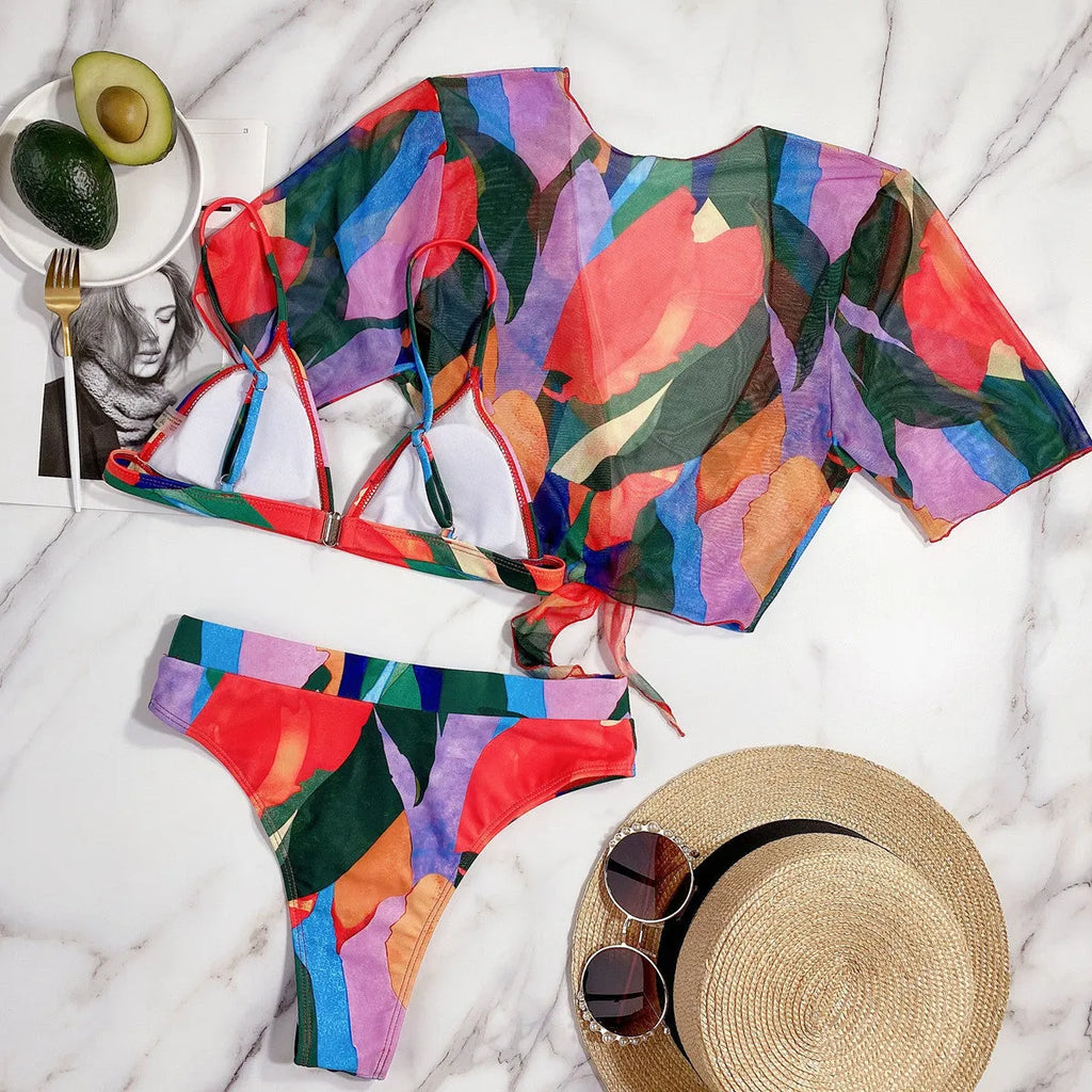 Red women's split-leg bikini swimsuit with triangle top on a mannequin.