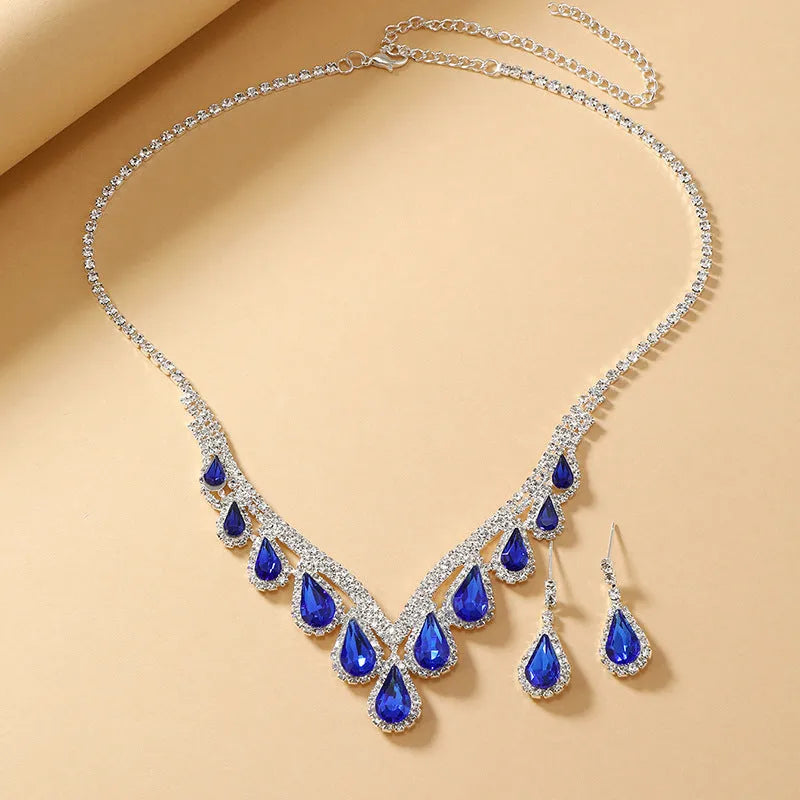 Sapphire blue alloy clavicle chain necklace and earrings set in Royal Blue White K finish on display
