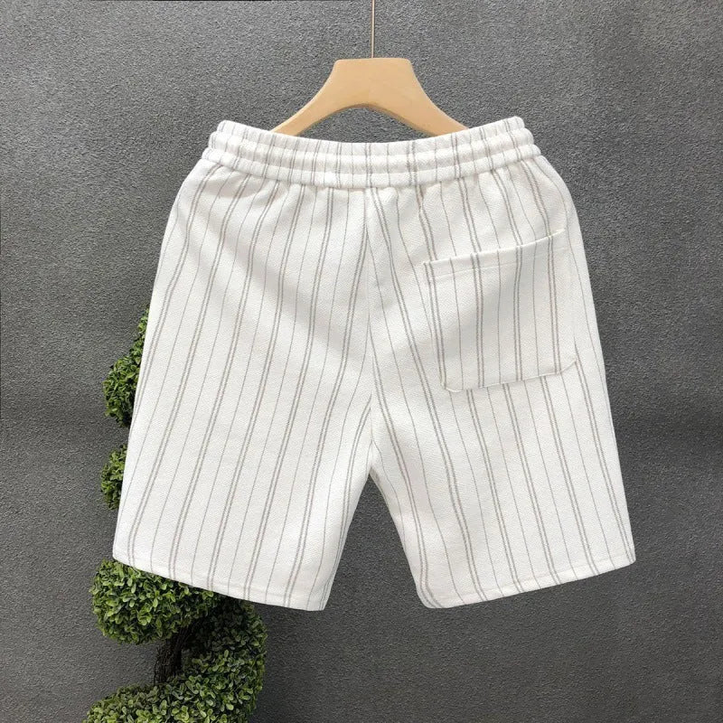 Men's black and white striped fleece-lined casual shorts showing straight leg and ankle band design.