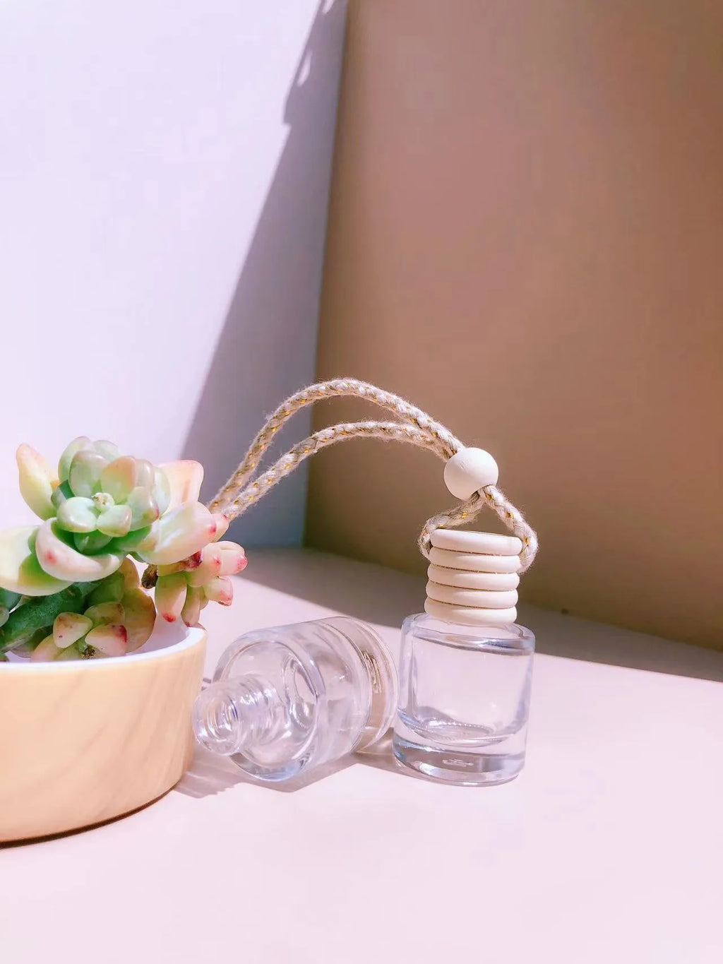 Car perfume pendant glass bottle air freshener with 8ml capacity, cylinder style, on rearview mirror