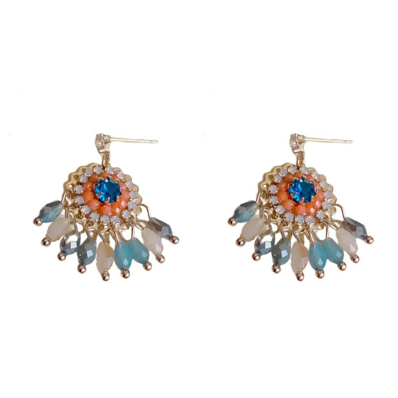 Women's round crystal tassel earrings with embedded diamonds in blue and purple geometric designs
