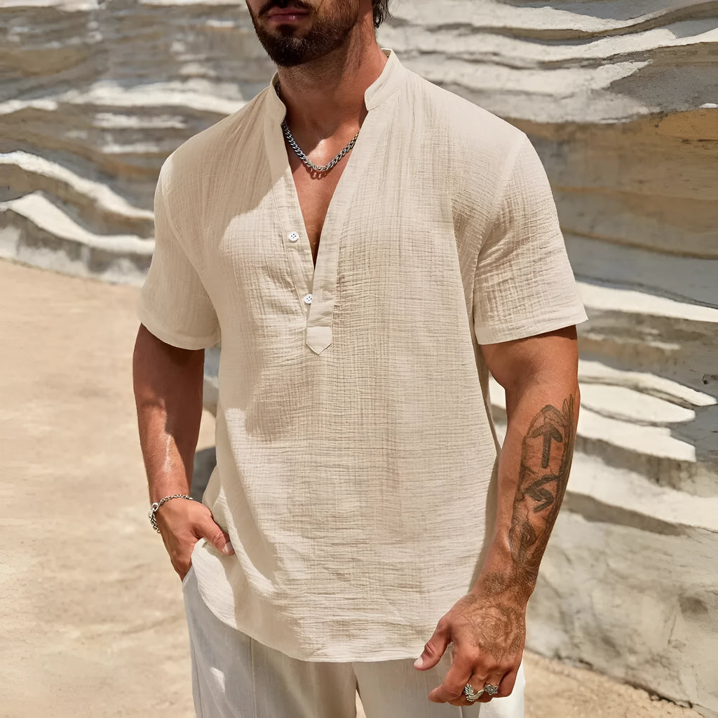 Men's solid colour short-sleeved stand collar shirt in a lightweight fabric on a hanger.