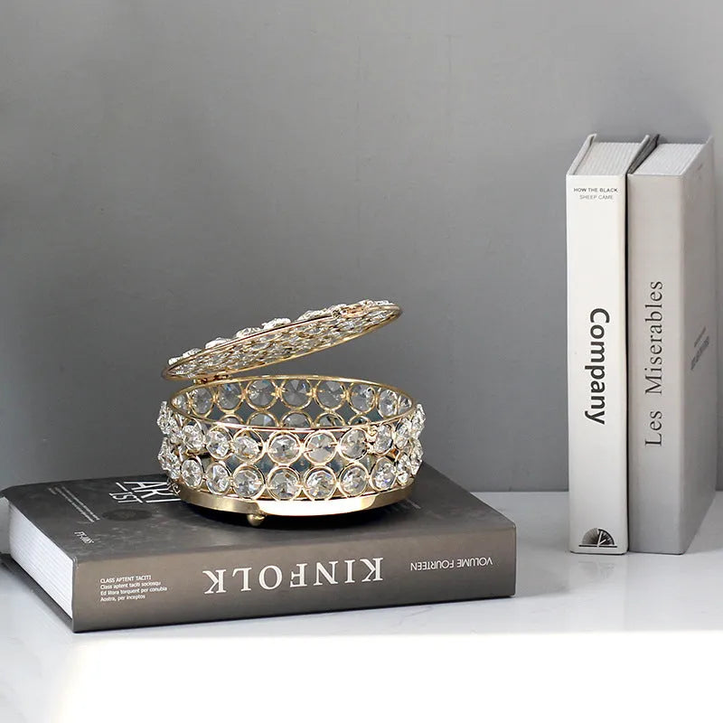 French gold iron frame transparent crystal glass jewelry storage box on a table