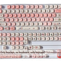 Pink fragrant pig design PBT plastic keycap for mechanical keyboards shown with keycap puller.