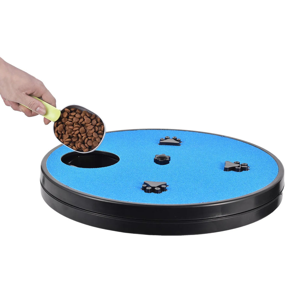 Square blue dog scratch pad with rotating top cover, suction cup base, and raised footprint guides.