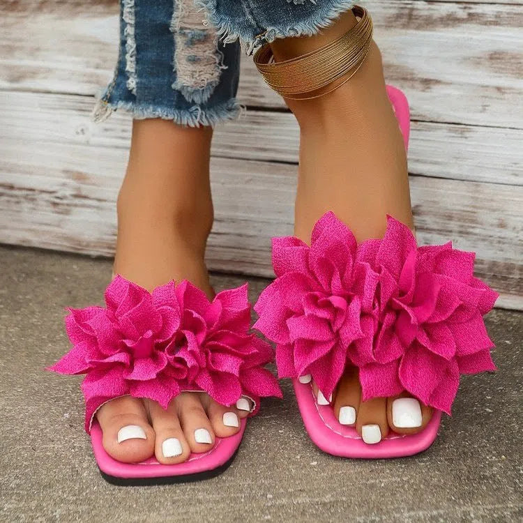 Women's flat flip-flops with flower detail, PU upper, rubber sole, apricot colour, on plain background