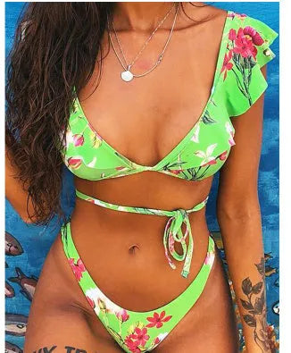 Yellow floral print split bikini swimsuit set on a mannequin, showing backless design.