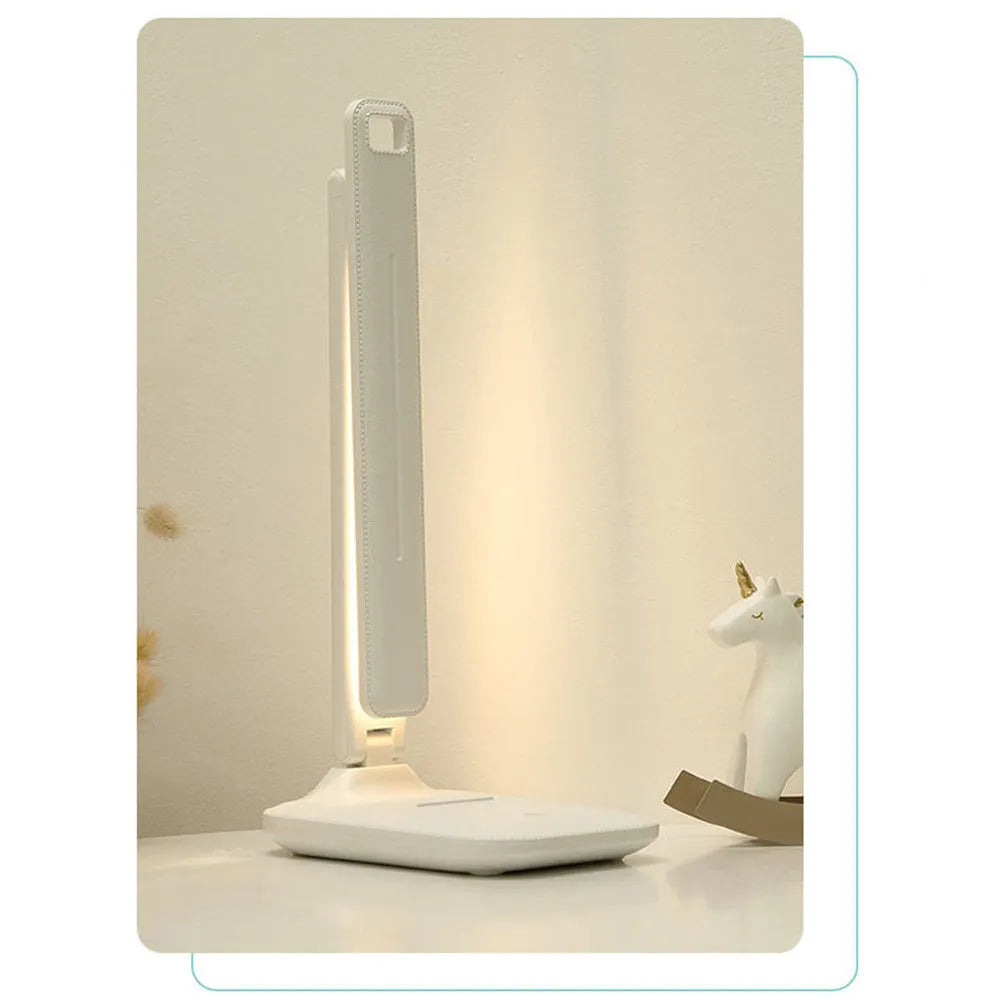 White plastic children's bedside lamp with touch dimming controls and USB charging port
