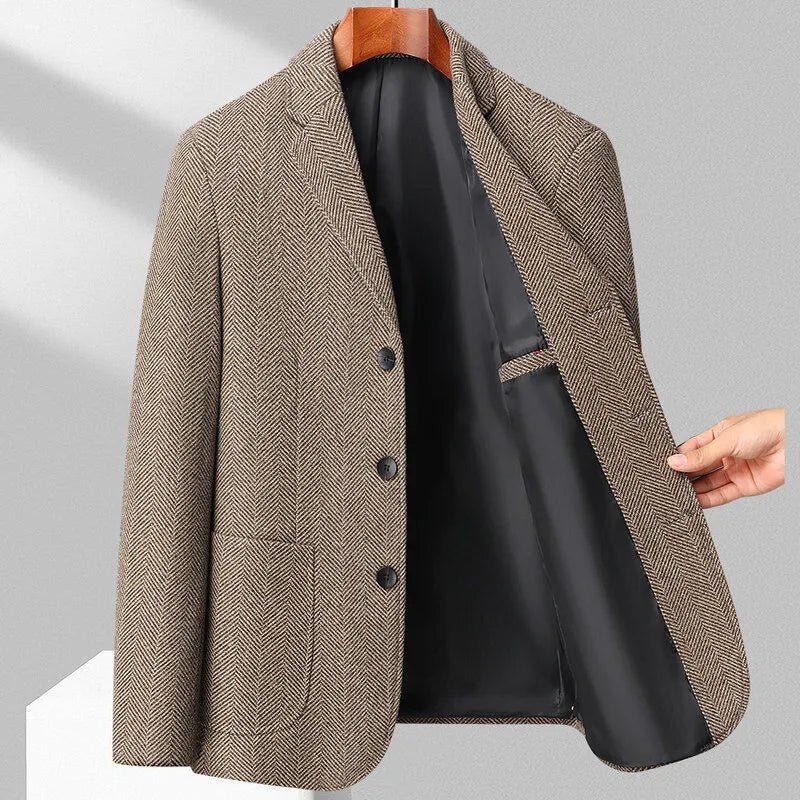 A man wearing a simple, loose-fit solid-colour woolen coat suitable for spring or autumn.