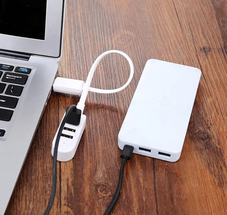 Cable separator hub with 3 USB ports and Micro USB interface on a desk